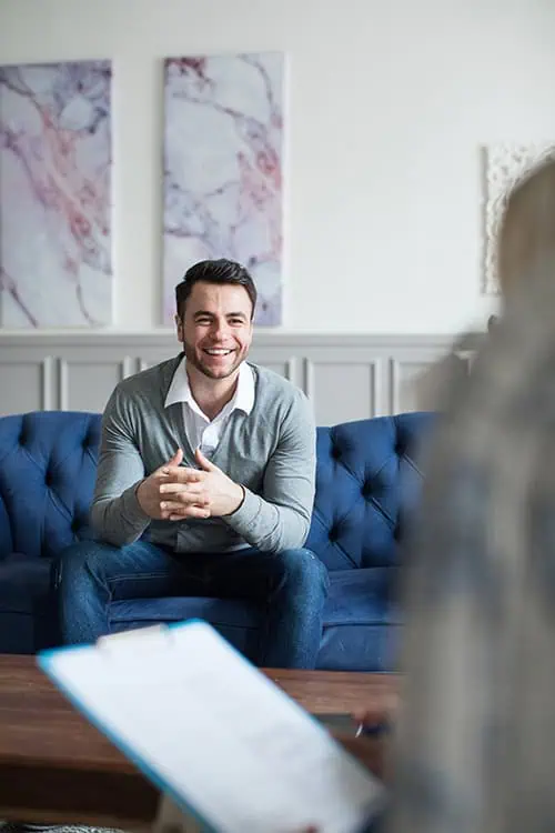 A man participates in therapy at a drug rehab.