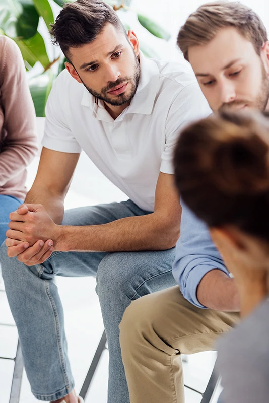 People participate in therapy at an alcohol rehab center.