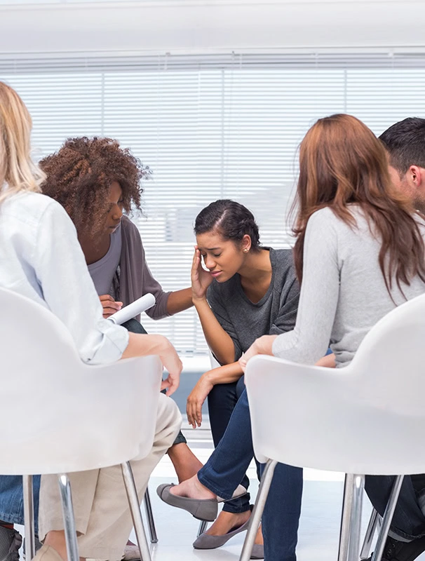 People participate in therapy at a fentanyl addiction treatment center.