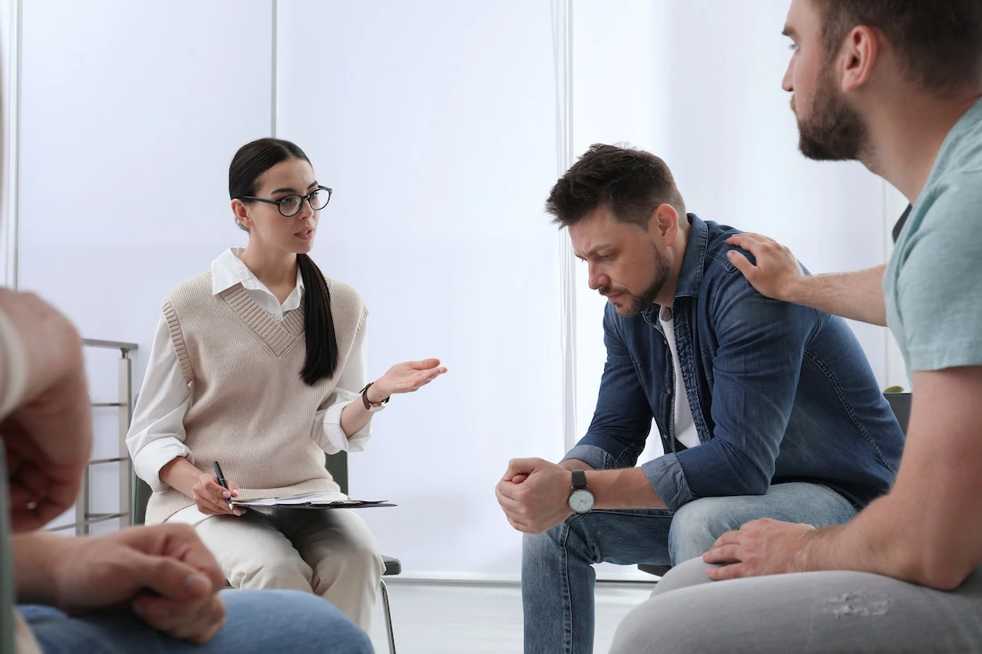 People participate in PTSD treatment.