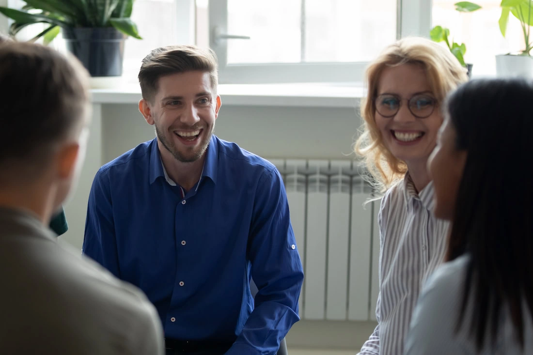People participate in therapy at a drug rehab center.
