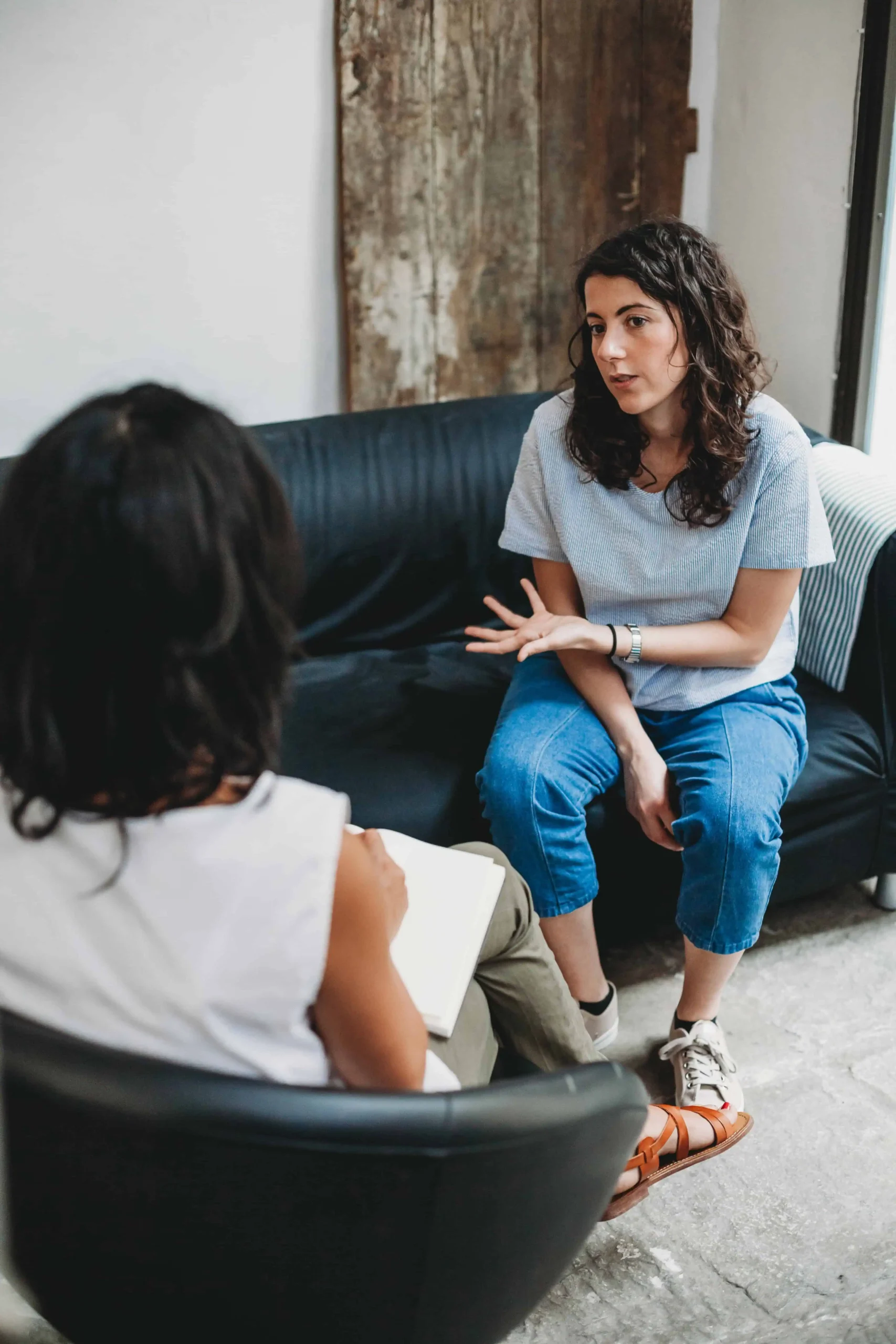 A person participates in therapy at a drug rehab center.