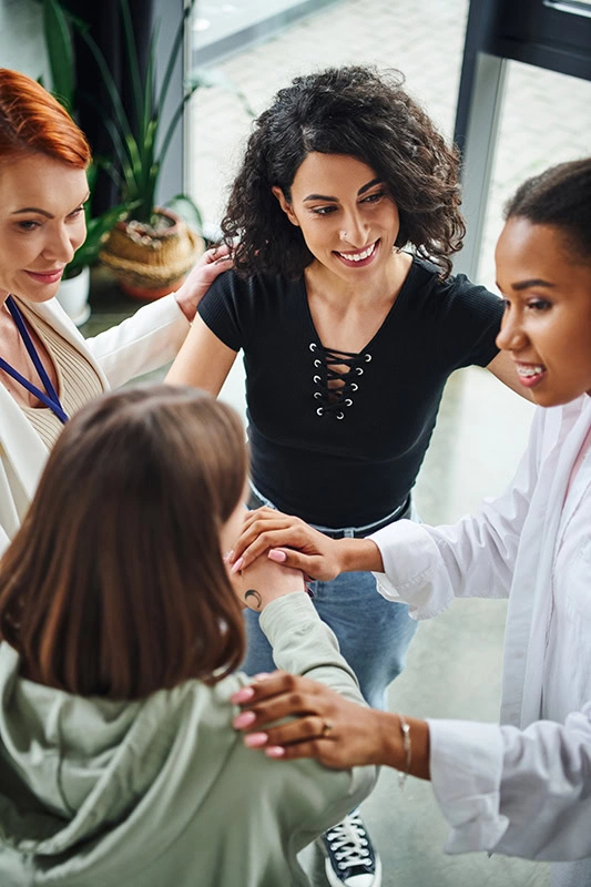 People participate in therapy at a drug rehab center.