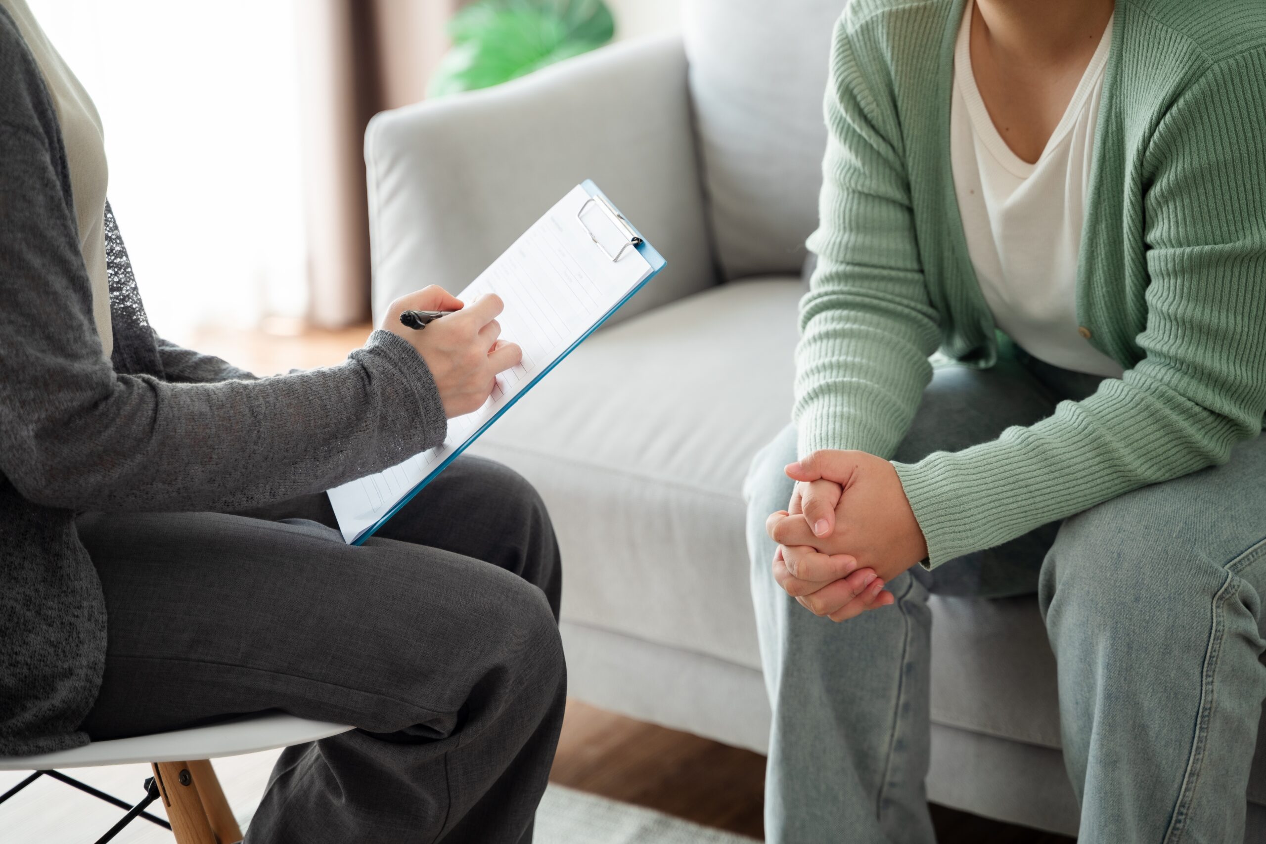 Woman talking to her therapist about regence bluecross blueshield drug rehab.