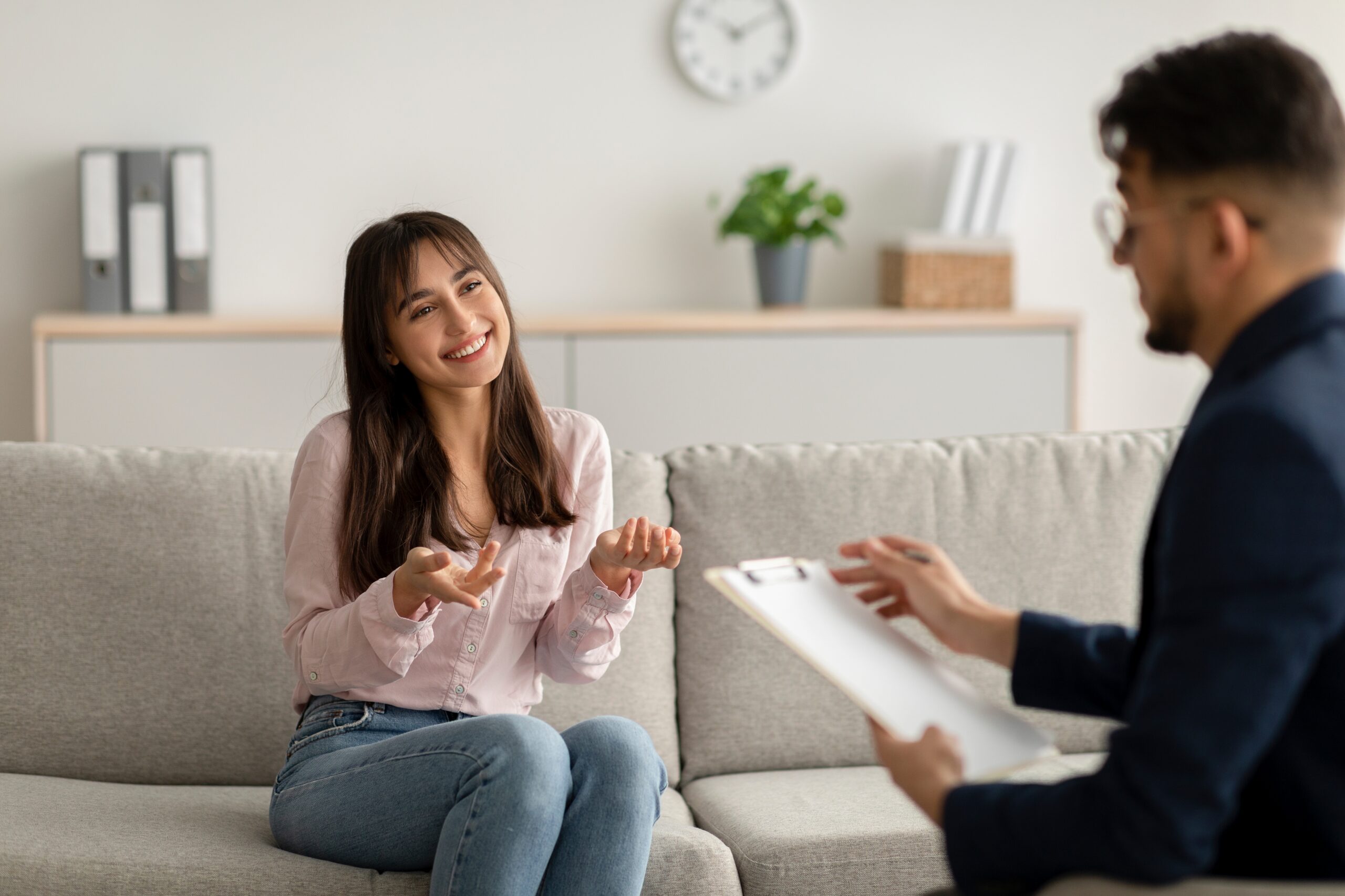 Woman talking to her therapist about drug rehab aftercare.