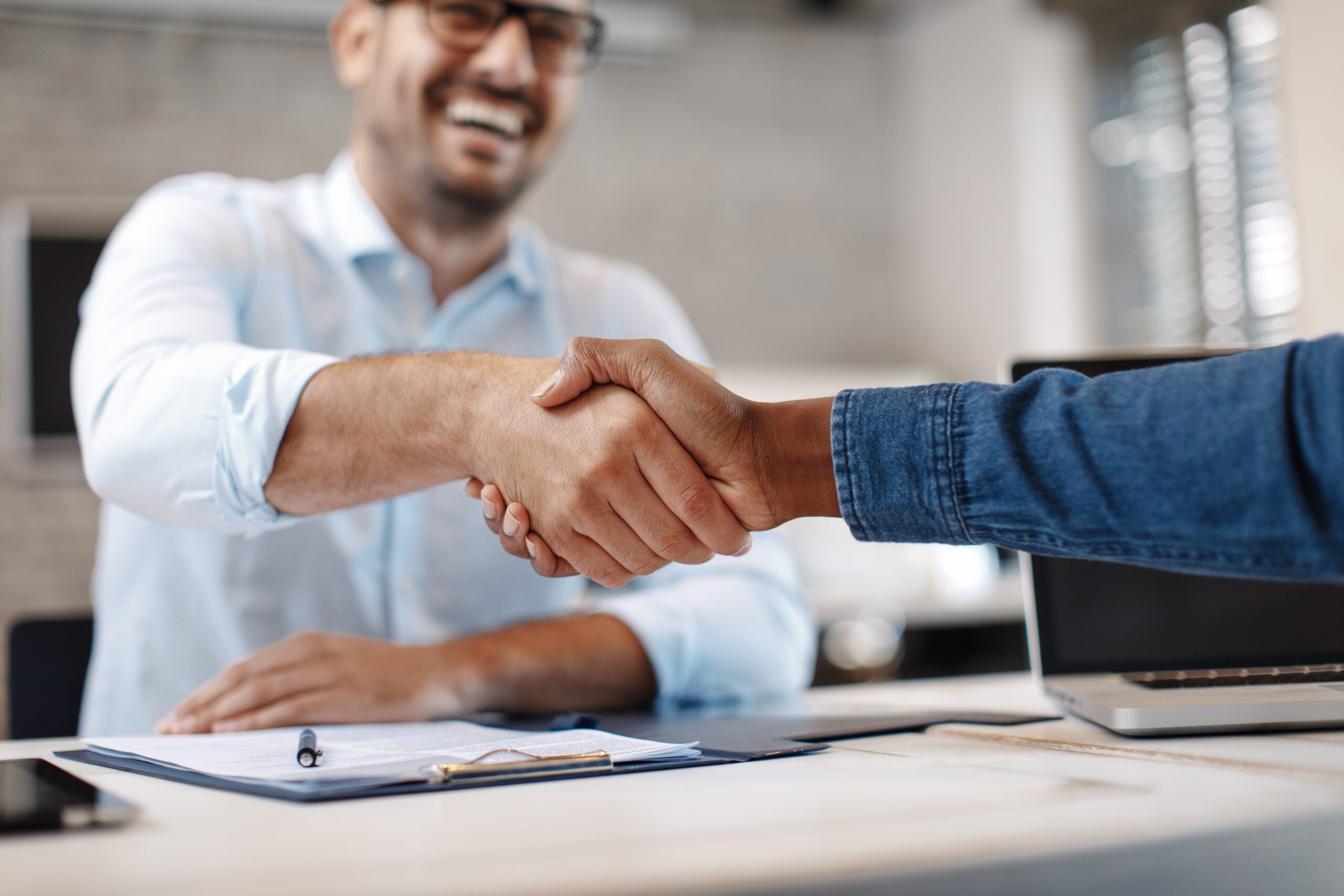 Shaking hands after finding a job after rehab.
