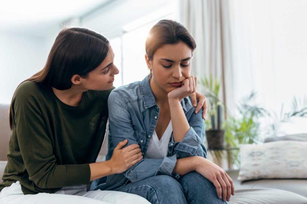 Woman supporting her friend after asking how to support a loved one in addiction recovery.