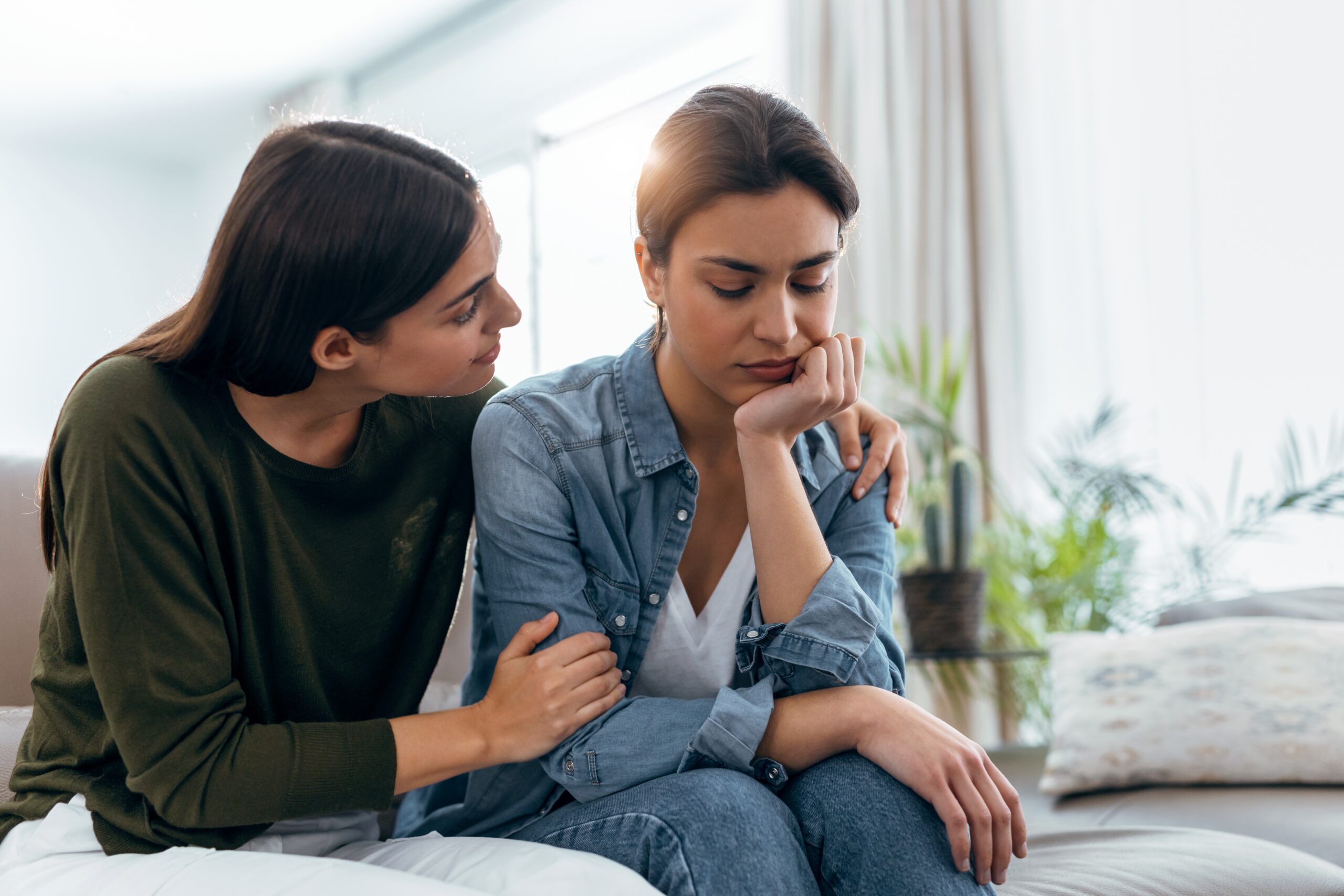Woman supporting her friend after asking how to support a loved one in addiction recovery.