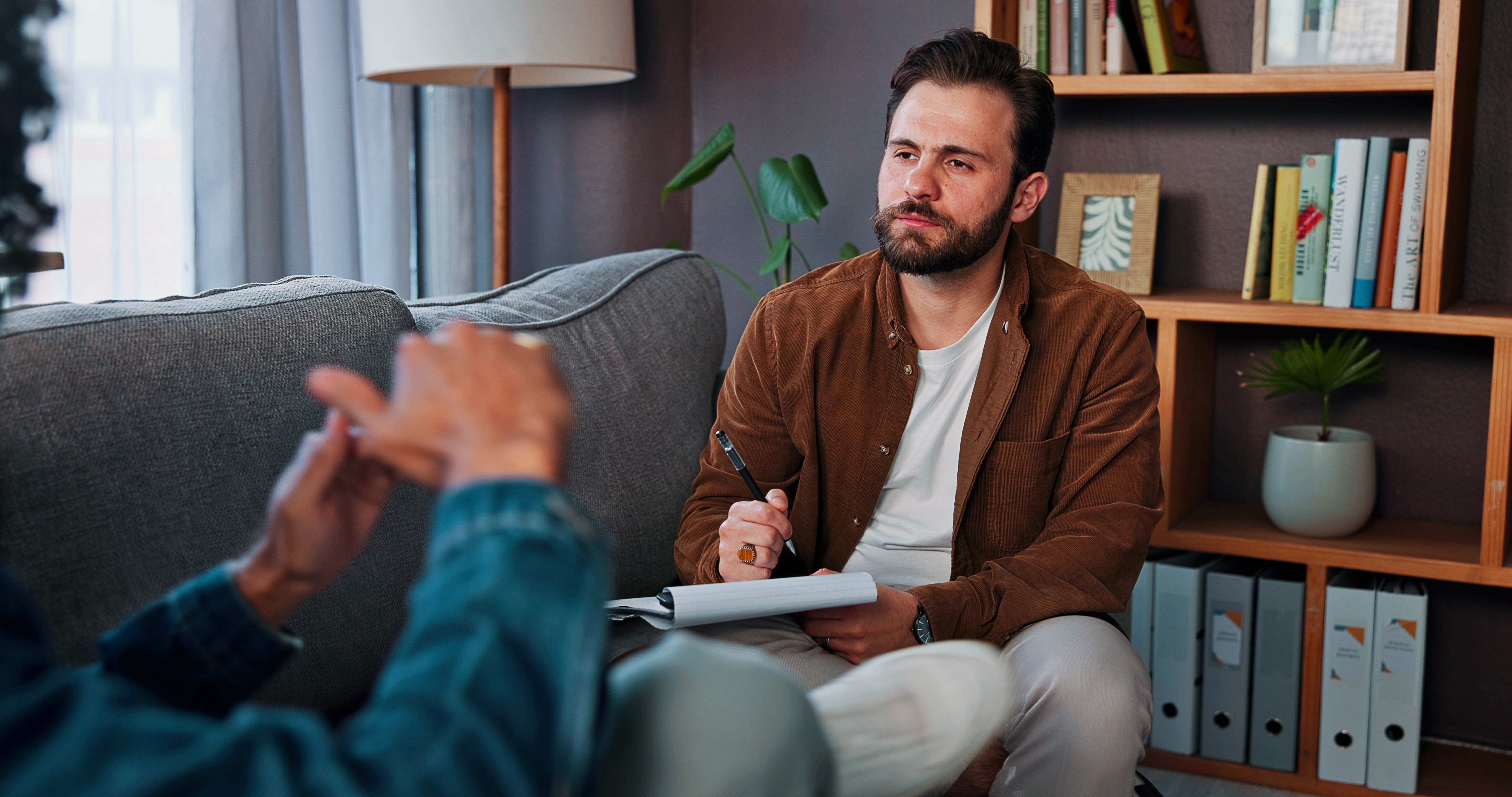 Man talking to therapist about relapse prevention programs.